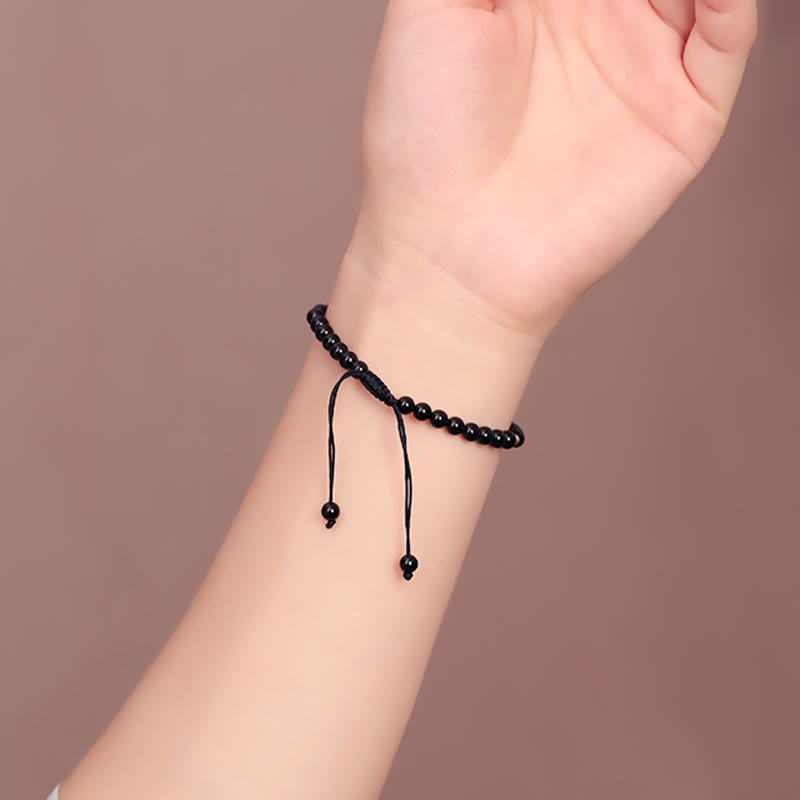 Pulsera de cuerda con pequeñas cuentas de obsidiana negra y piedras de Buda
