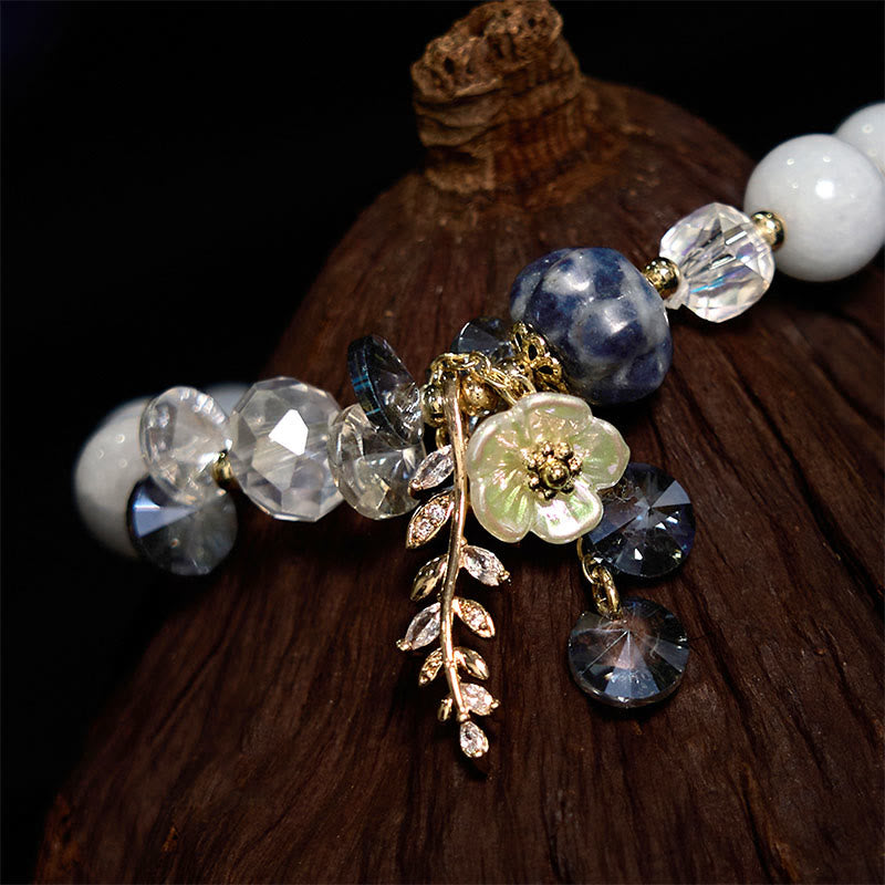 Pulsera curativa de amatista, cristal azul y piedra solar con aventurina verde.