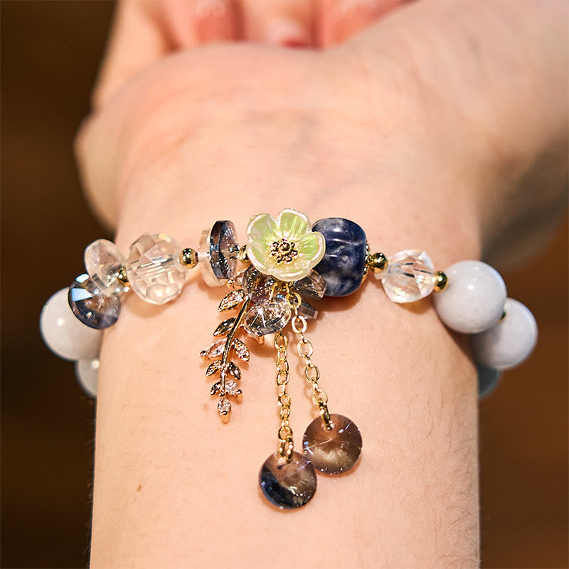 Pulsera curativa de amatista, cristal azul y piedra solar con aventurina verde.