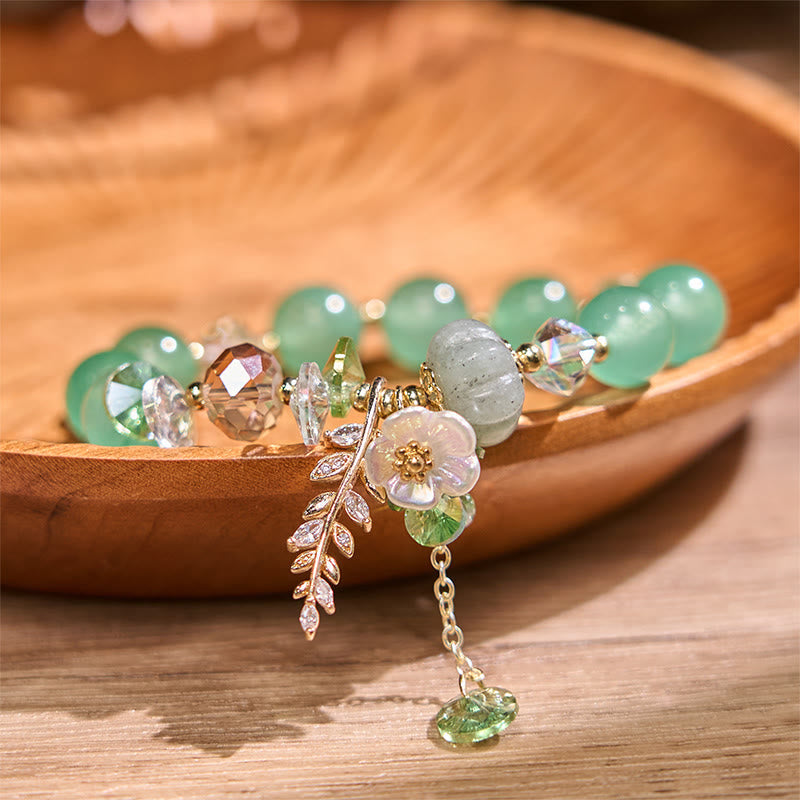Pulsera curativa de amatista, cristal azul y piedra solar con aventurina verde.