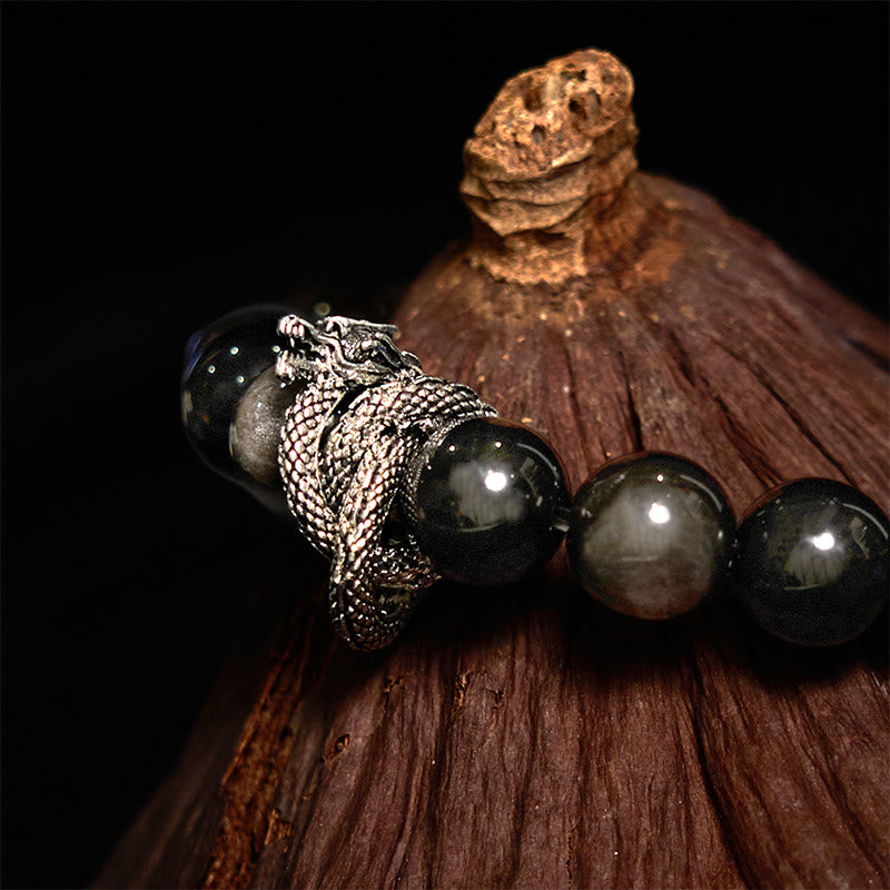 Pulsera protectora de obsidiana con dragón y piedras de Buda con brillo plateado