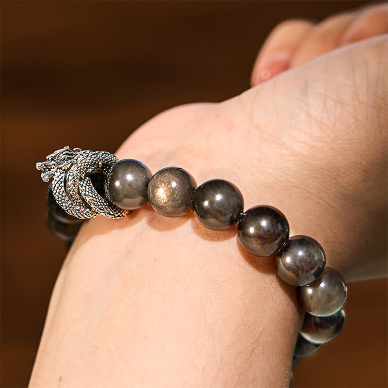Pulsera protectora de obsidiana con dragón y piedras de Buda con brillo plateado