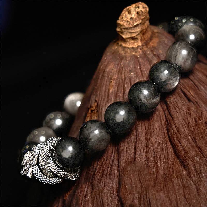 Pulsera protectora de obsidiana con dragón y piedras de Buda con brillo plateado