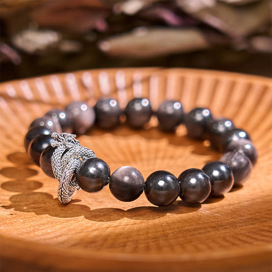 Pulsera protectora de obsidiana con dragón y piedras de Buda con brillo plateado