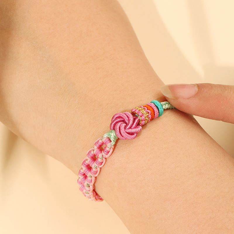 Pulsera trenzada con nudo de flor de durazno rosa y verde hecha a mano con piedras de Buda