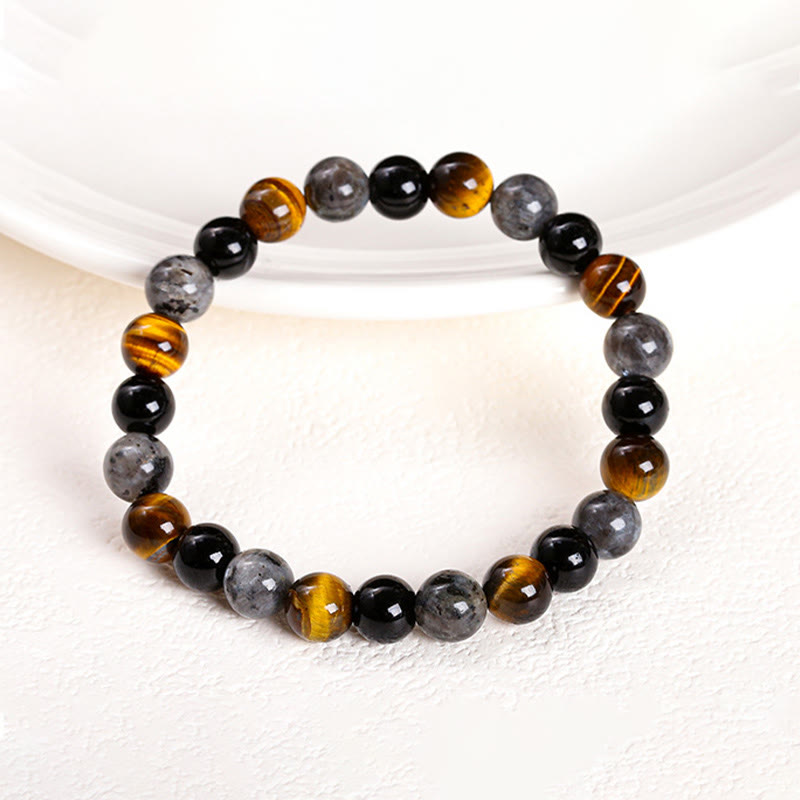 Pulsera de protección con piedras de Buda, ojo de tigre, piedra brillante negra, cuentas de vidrio negro, obsidiana copo de nieve, roca de lava y rodonita.