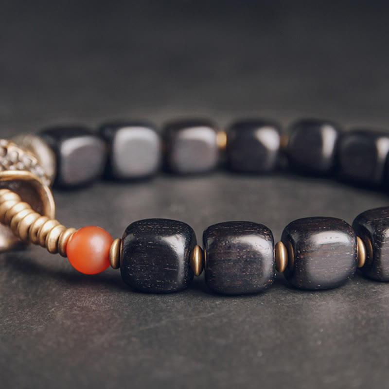 Pulsera de la paz con piedras de Buda, madera de ébano, cobre, latón y ágata roja