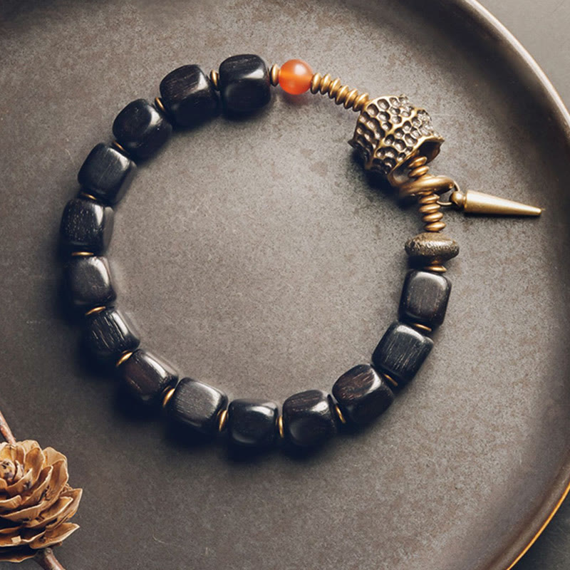 Pulsera de la paz con piedras de Buda, madera de ébano, cobre, latón y ágata roja