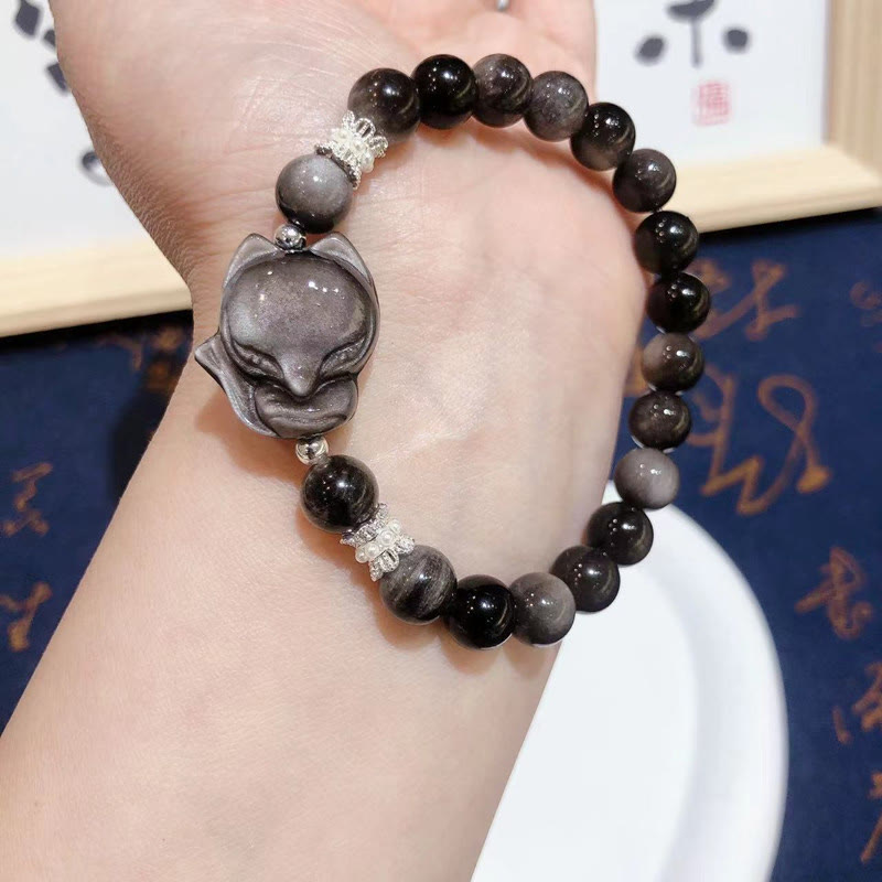 Pulsera de comunicación de zorro de nueve colas de obsidiana con brillo plateado natural de Buddha Stones