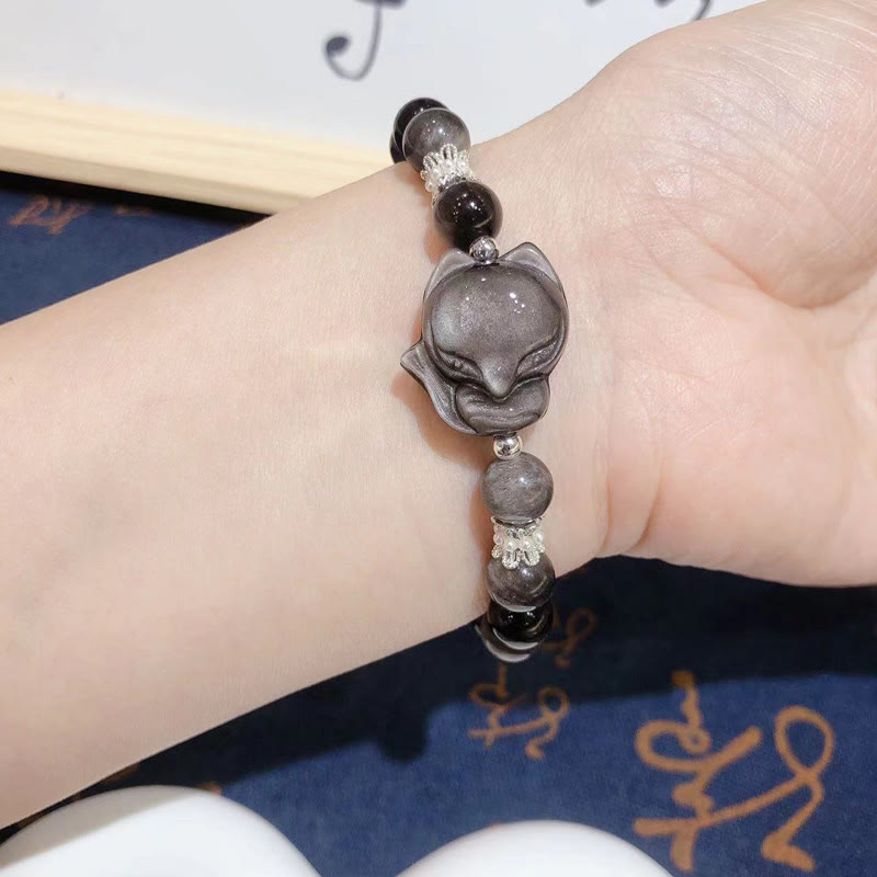 Pulsera de comunicación de zorro de nueve colas de obsidiana con brillo plateado natural de Buddha Stones