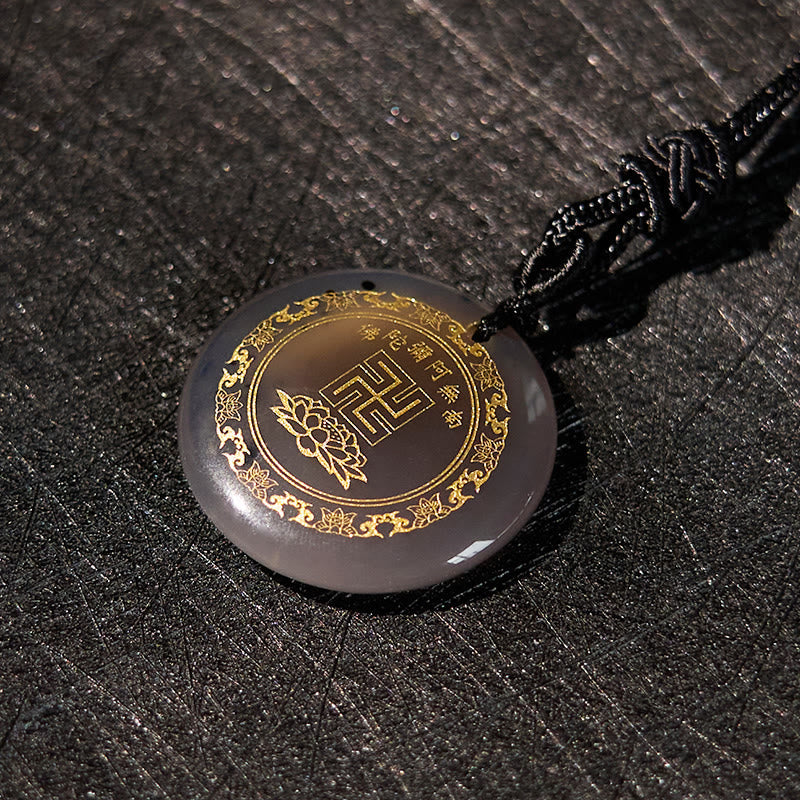 Collar con colgante de obsidiana negra con cristales naturales y varios diseños de loto y esvástica de Buda.