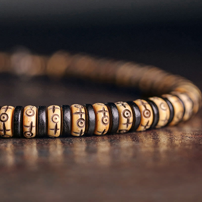 Pulsera de doble vuelta con piedras de Buda, hueso de yak, madera de ébano, cobre y latón.