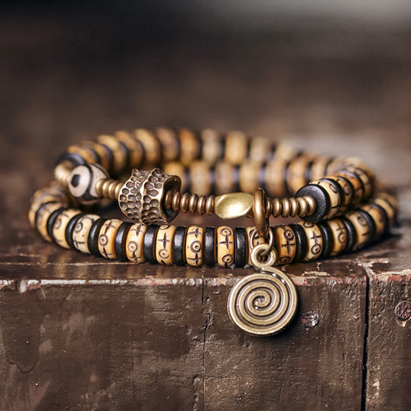 Pulsera de doble vuelta con piedras de Buda, hueso de yak, madera de ébano, cobre y latón.