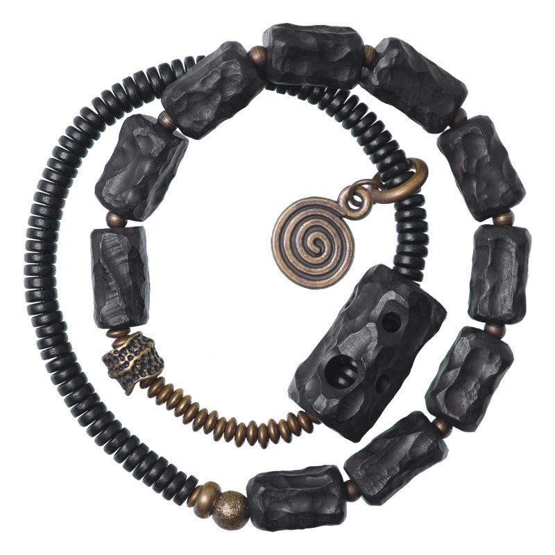 Pulsera de doble vuelta con piedras de Buda, madera de ébano, cobre, latón y ágata roja.