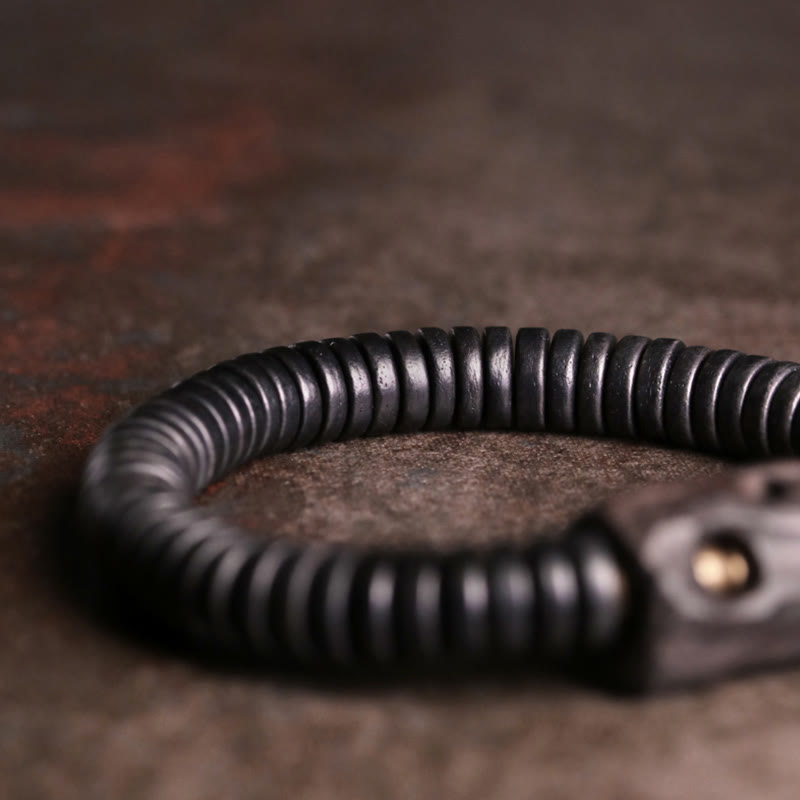 Pulsera de equilibrio perforada con piedras de Buda, madera de ébano, cobre y latón