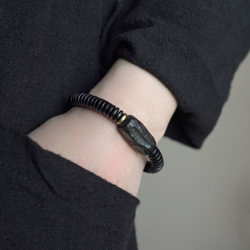 Pulsera de equilibrio perforada con piedras de Buda, madera de ébano, cobre y latón