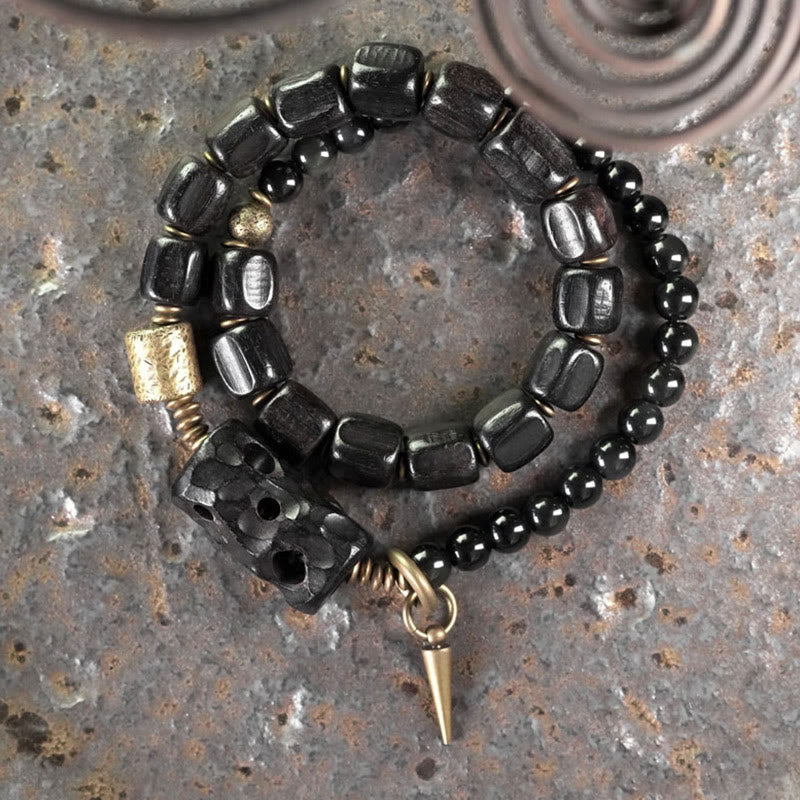 Pulsera de doble vuelta con piedras de Buda, madera de ébano, obsidiana negra, cobre y latón.