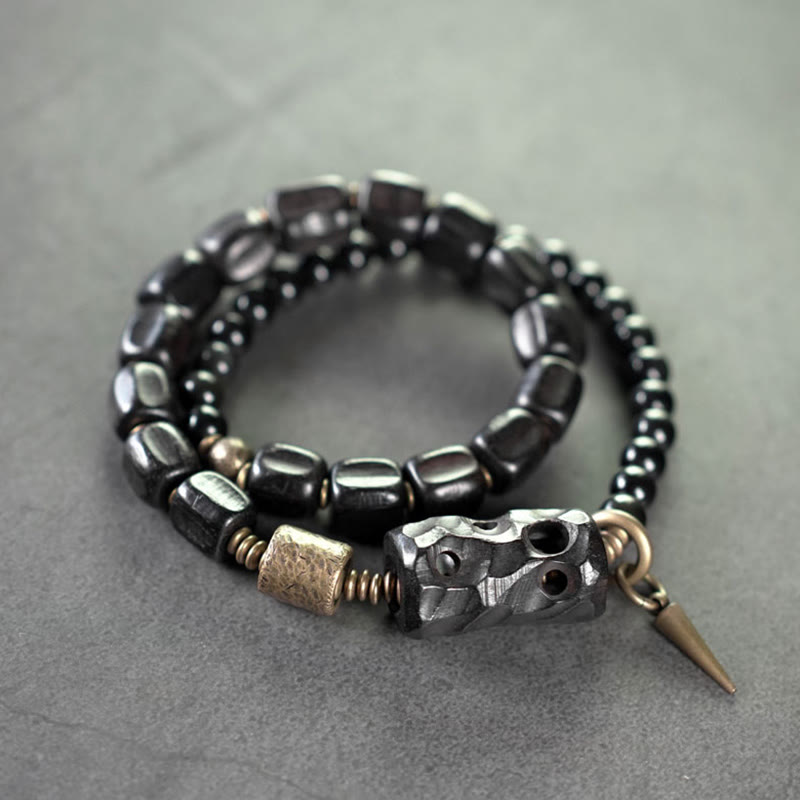 Pulsera de doble vuelta con piedras de Buda, madera de ébano, obsidiana negra, cobre y latón.