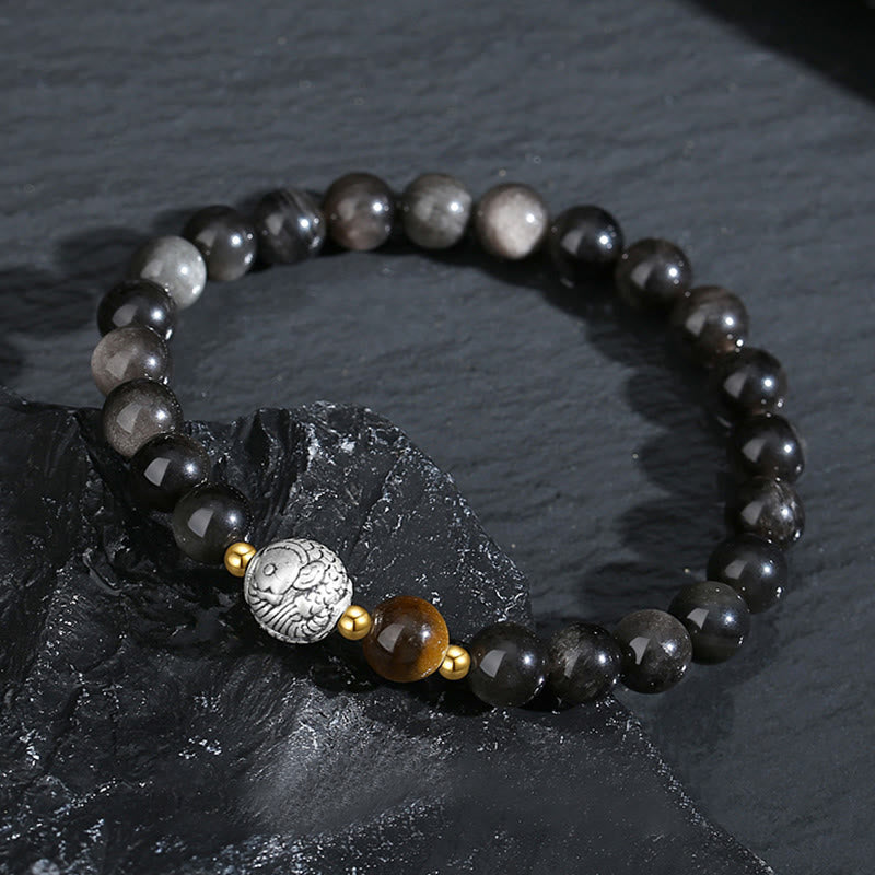 Pulsera purificadora de pez koi con obsidiana negra y ojo de tigre en plata de ley 925.