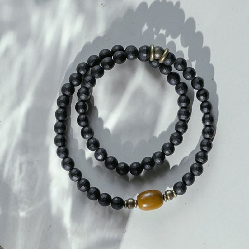 Pulsera protectora de doble vuelta con cuentas de topacio ónix negro y superficie esmerilada de Buda