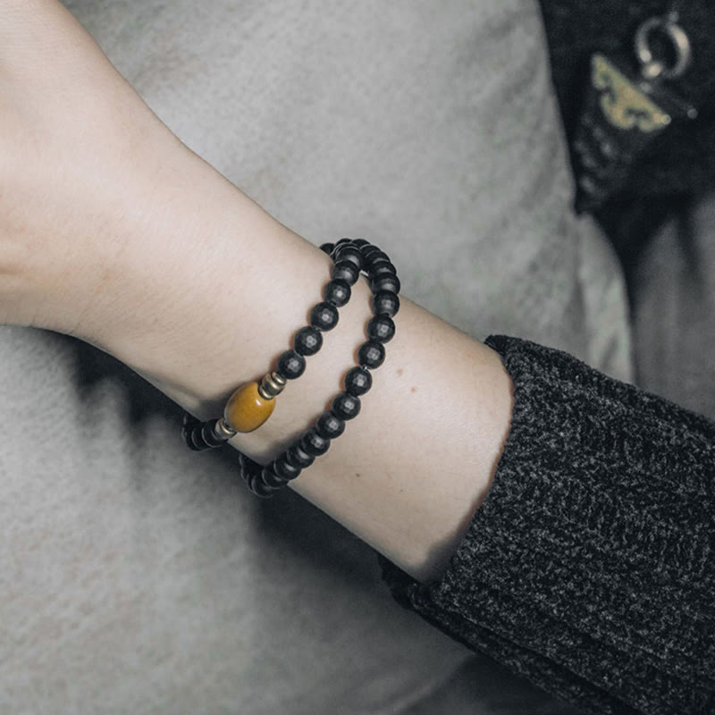Pulsera protectora de doble vuelta con cuentas de topacio ónix negro y superficie esmerilada de Buda