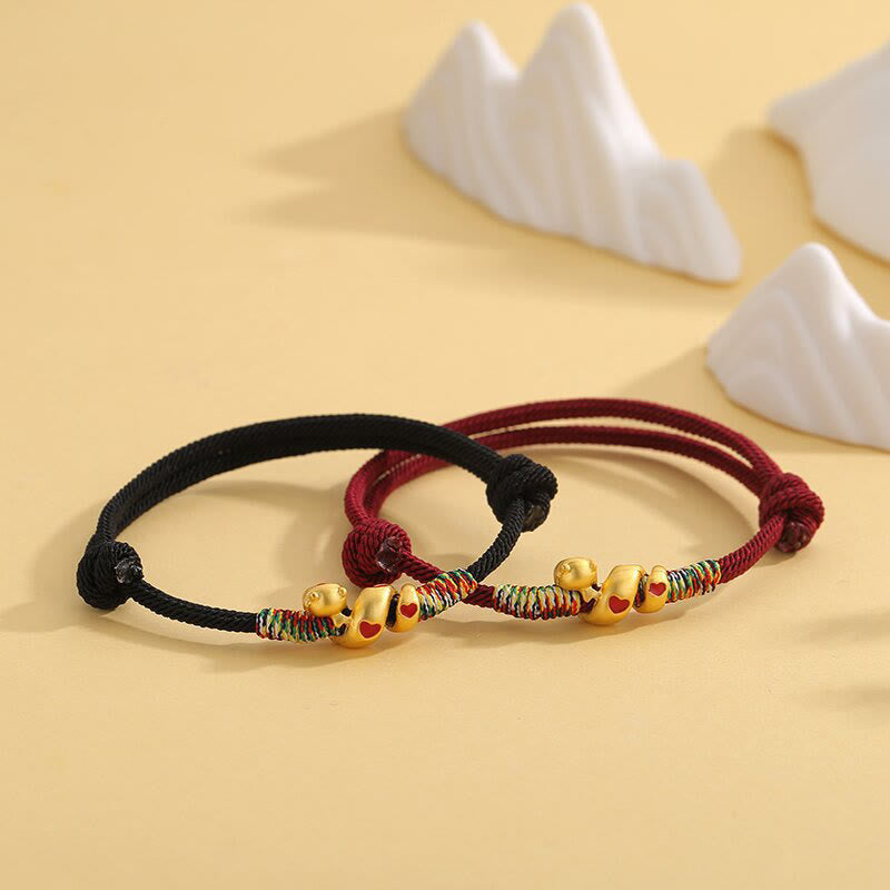 Pulsera trenzada de aleación de cobre con hilo rojo y piedras de Buda para proteger el Año de la Serpiente