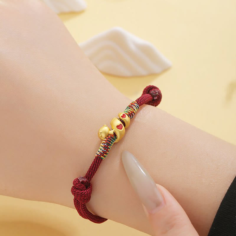 Pulsera trenzada de aleación de cobre con hilo rojo y piedras de Buda para proteger el Año de la Serpiente