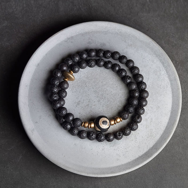 Pulsera curativa de doble vuelta con cuentas de latón y cobre de tres ojos de roca de lava vintage de Buda