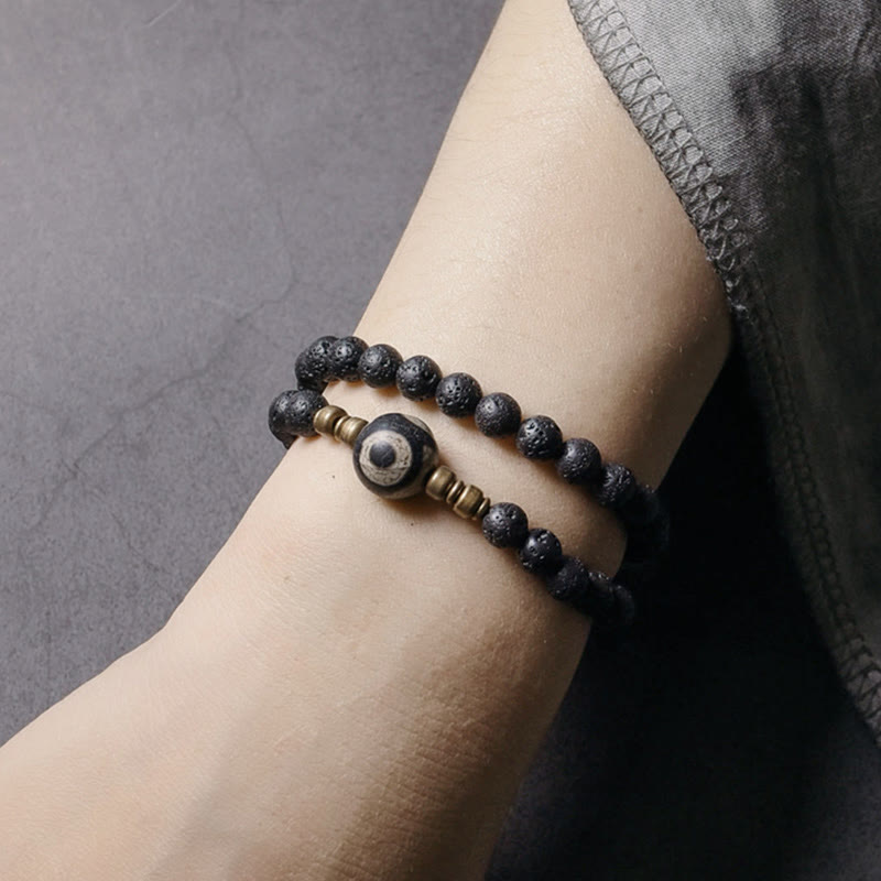 Pulsera curativa de doble vuelta con cuentas de latón y cobre de tres ojos de roca de lava vintage de Buda