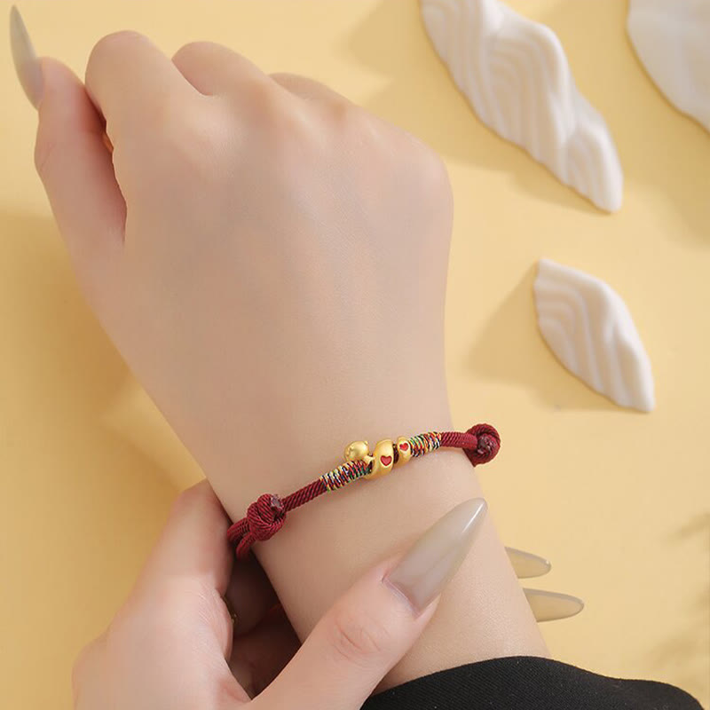 Pulsera trenzada de aleación de cobre con hilo rojo y piedras de Buda para proteger el Año de la Serpiente