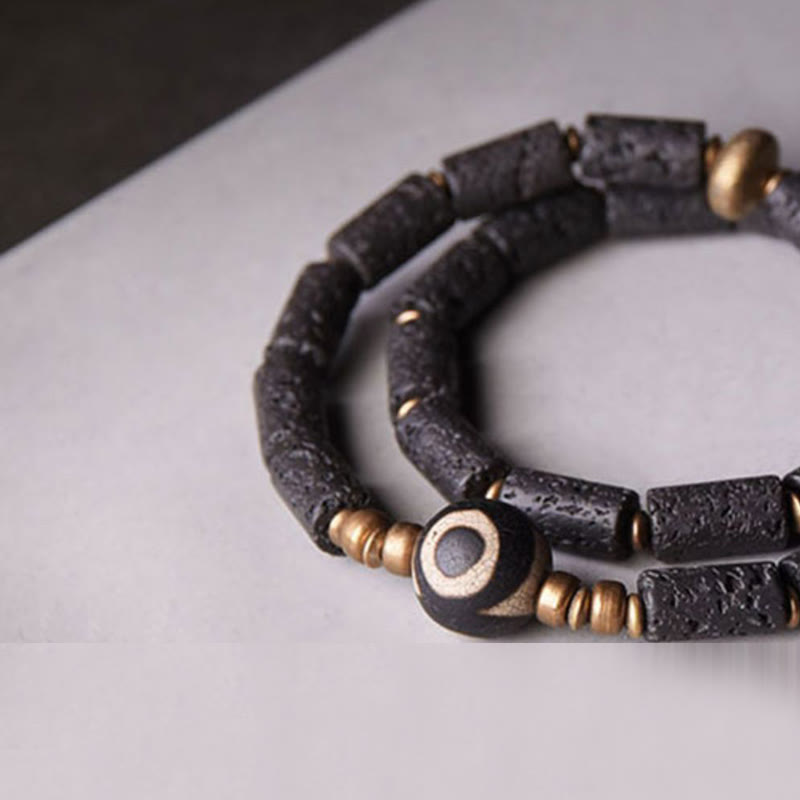 Pulsera de calma con múltiples vueltas de cobre y latón con cuentas Dzi de tres ojos de roca volcánica vintage de Buda