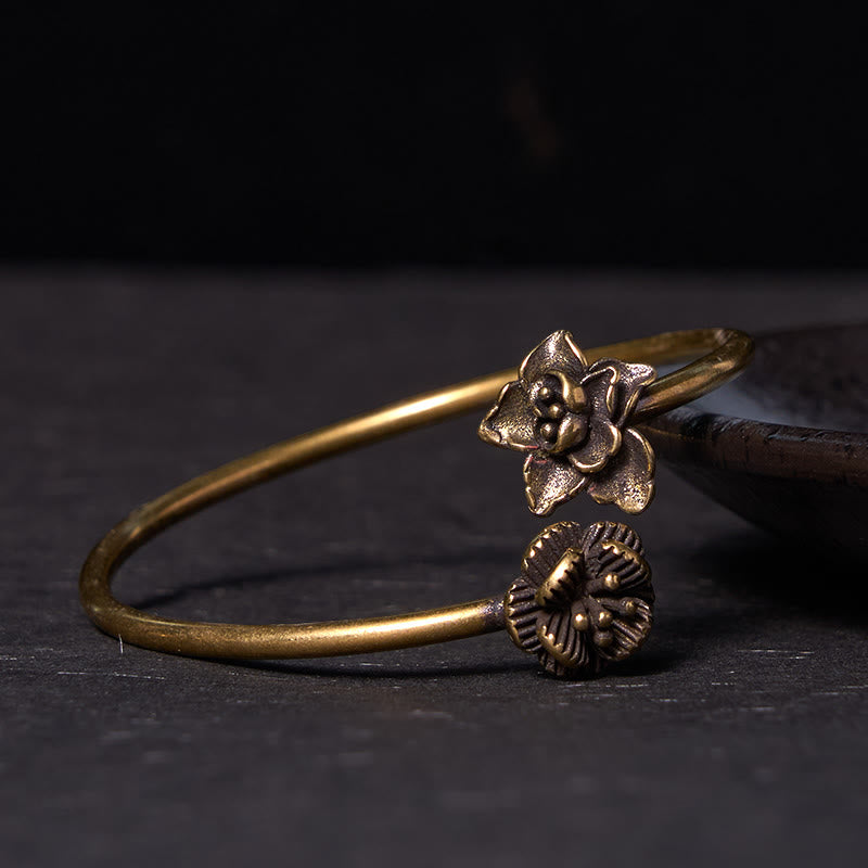 Pulsera curativa de cobre y latón con piedras de Buda y flor de durazno