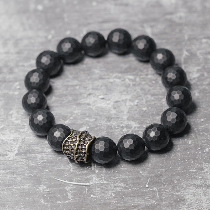 Pulsera protectora de cobre y latón con ónix negro mate y piedras de Buda