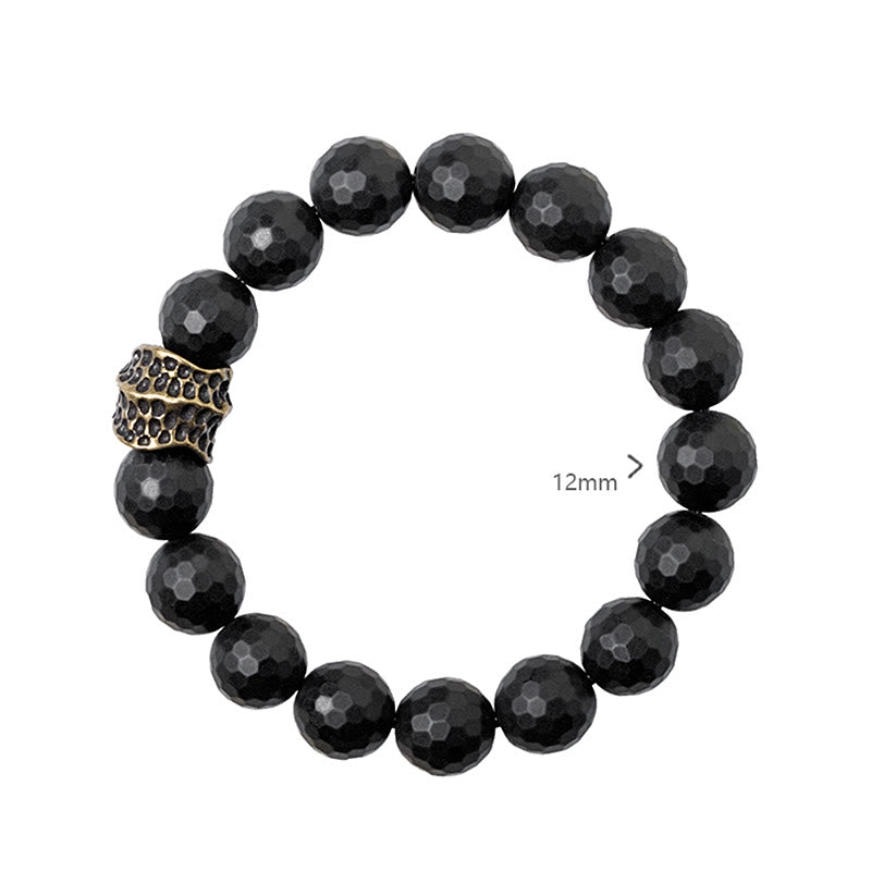 Pulsera protectora de cobre y latón con ónix negro mate y piedras de Buda