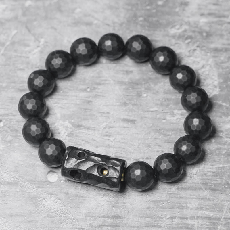 Pulsera protectora de ébano y ónix negro con superficie mate esmerilada de Buddha Stones