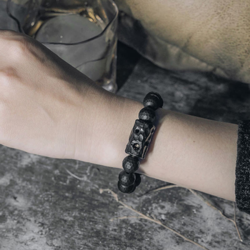 Pulsera protectora de ébano y ónix negro con superficie mate esmerilada de Buddha Stones