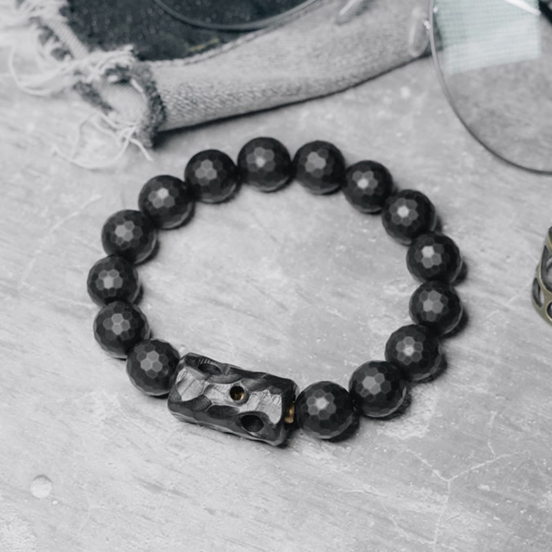 Pulsera protectora de ébano y ónix negro con superficie mate esmerilada de Buddha Stones