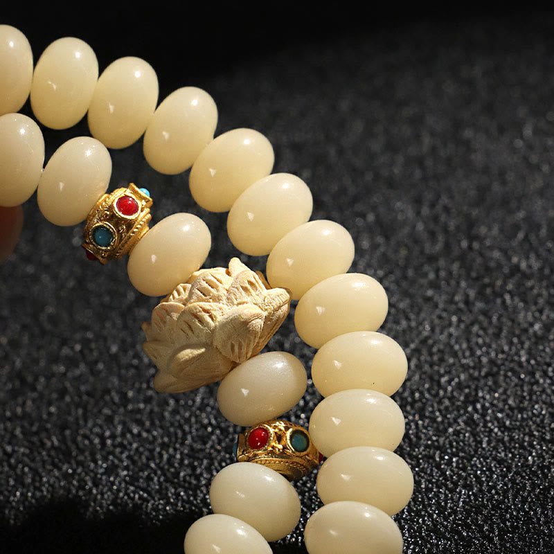 Pulsera de doble vuelta con semillas de bodhi y madera de melocotón, loto y riqueza