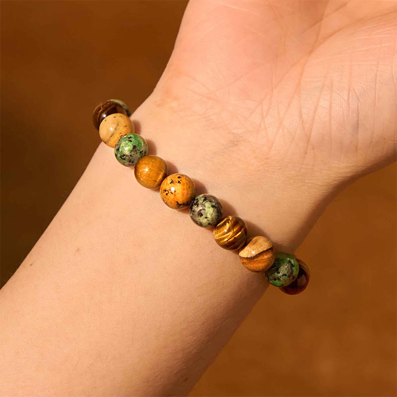 Pulsera protectora con cuentas de Buda, jaspe, turquesa, ojo de tigre y cuentas combinables.