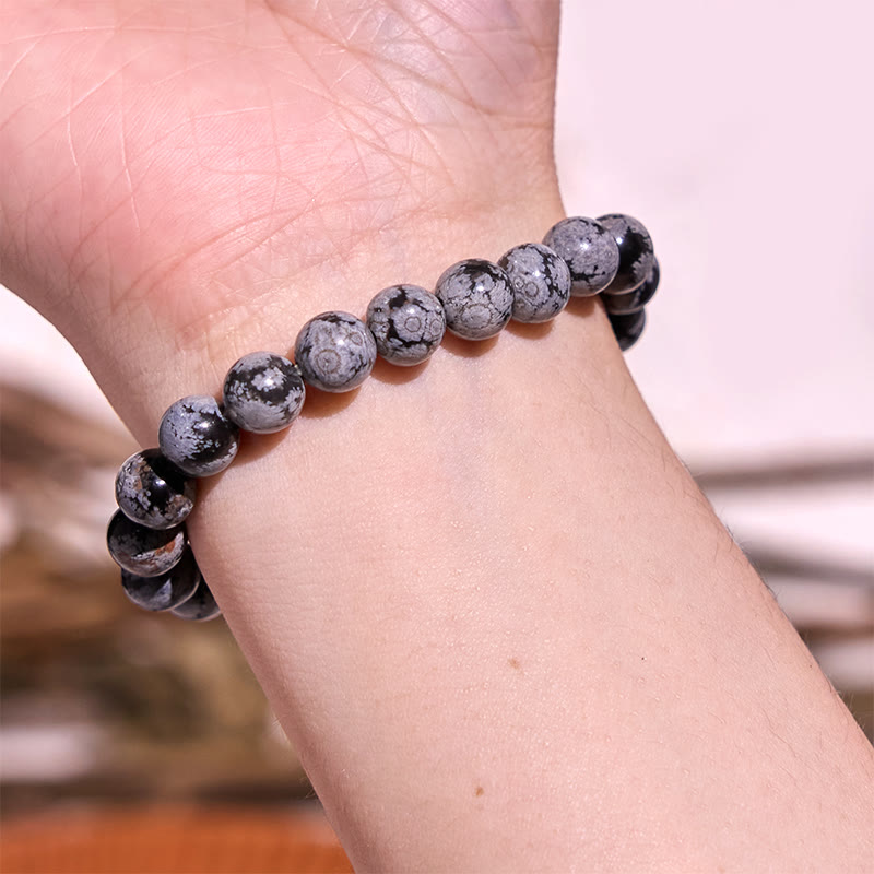 Pulsera de equilibrio de obsidiana y copo de nieve de piedra de Buda
