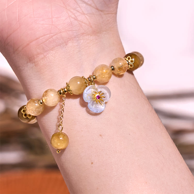 Pulsera de generosidad con citrino, ojo de tigre y flor de Buda