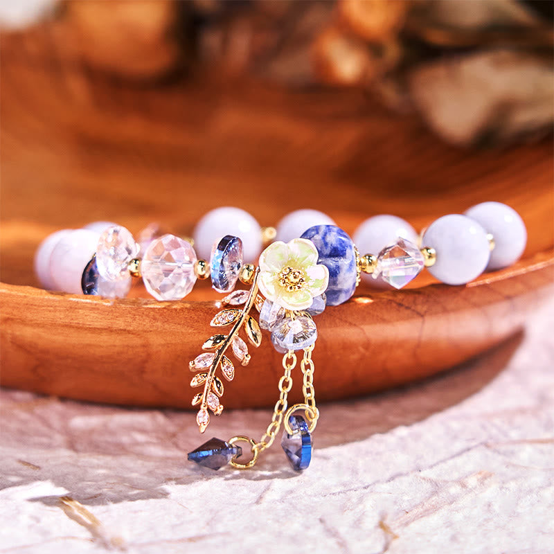Pulsera curativa de amatista, cristal azul y piedra solar con aventurina verde.