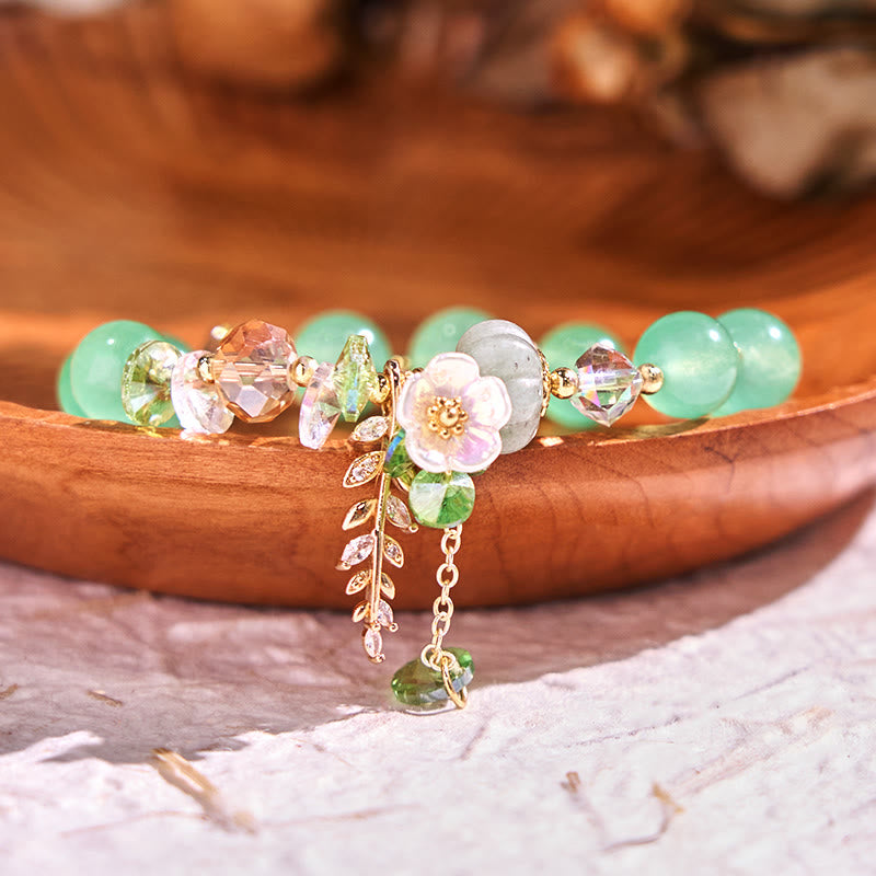 Pulsera curativa de amatista, cristal azul y piedra solar con aventurina verde.