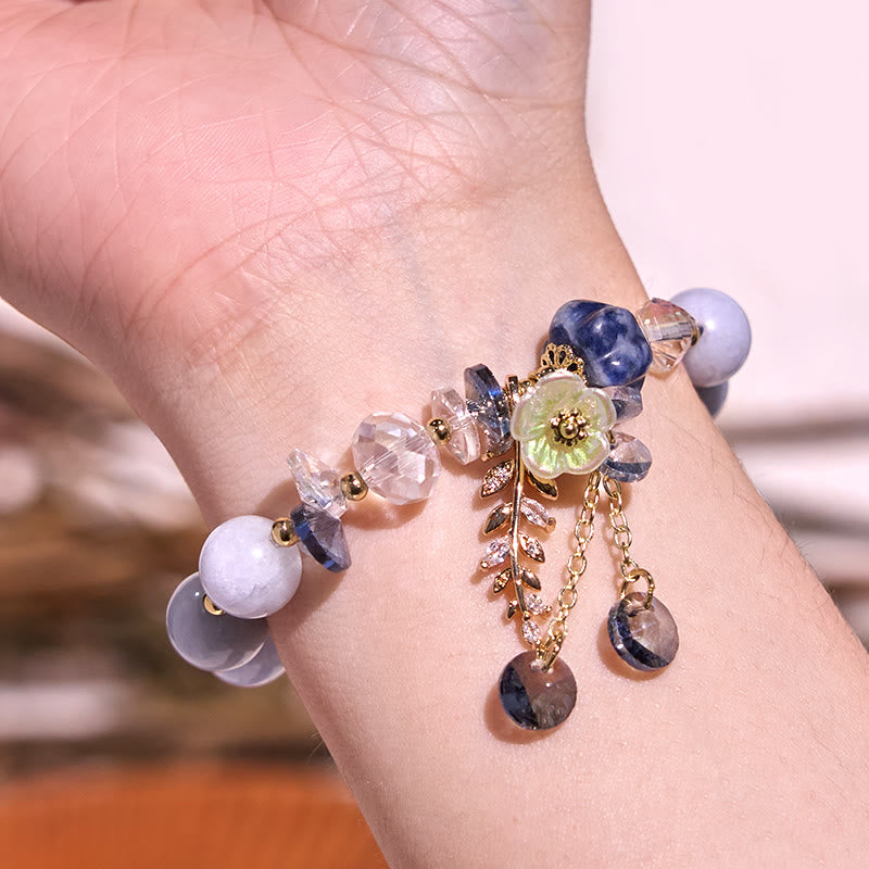 Pulsera curativa de amatista, cristal azul y piedra solar con aventurina verde.
