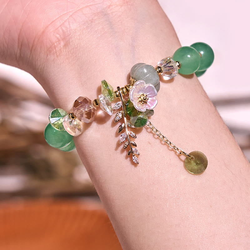 Pulsera curativa de amatista, cristal azul y piedra solar con aventurina verde.