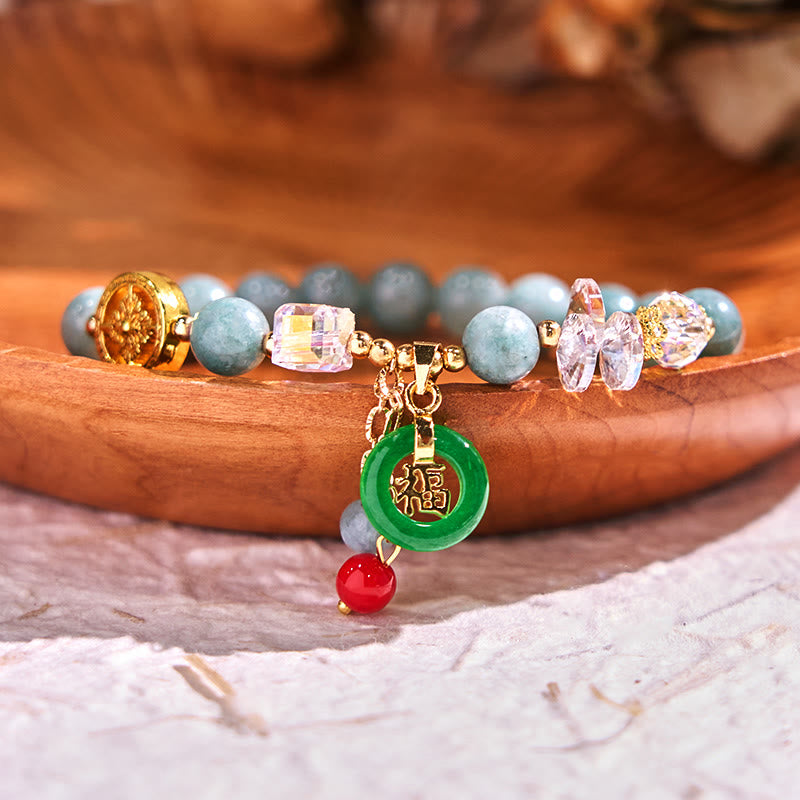 Pulsera curativa con dijes de jade fu y cuarzo fresa de Buda
