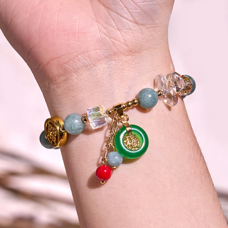 Pulsera curativa con dijes de jade fu y cuarzo fresa de Buda