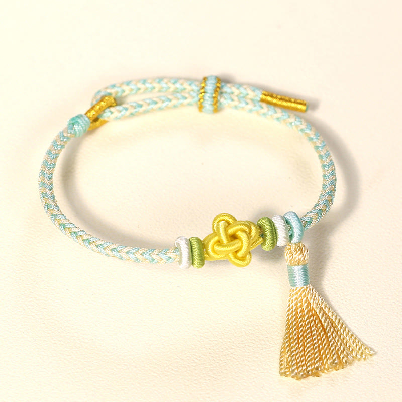 Pulsera protectora con borlas y nudo de flor de durazno con piedras de Buda