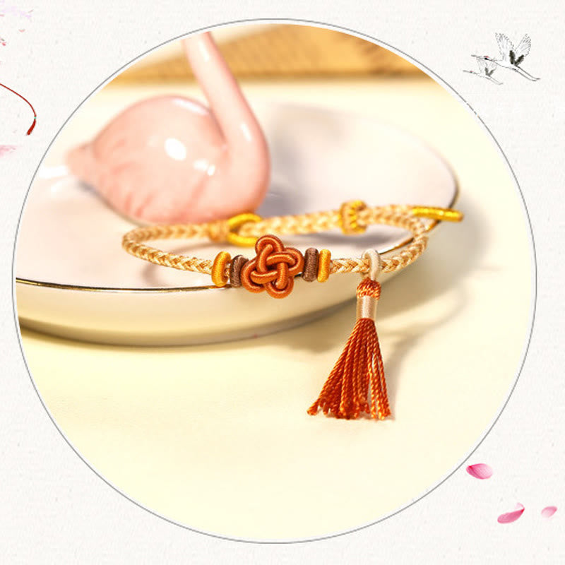 Pulsera protectora con borlas y nudo de flor de durazno con piedras de Buda