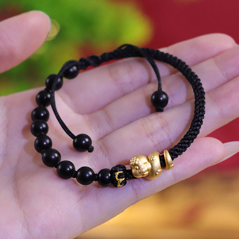 Pulsera trenzada de cuerda de algodón con cuentas de madera de ébano y sándalo rojo de hoja pequeña de Buda, año de la serpiente 999.